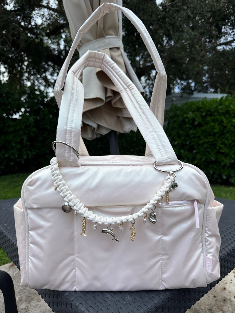 Calpak Luka Mini Duffel in Pearlescent and Sea Life Rope Bag Charm